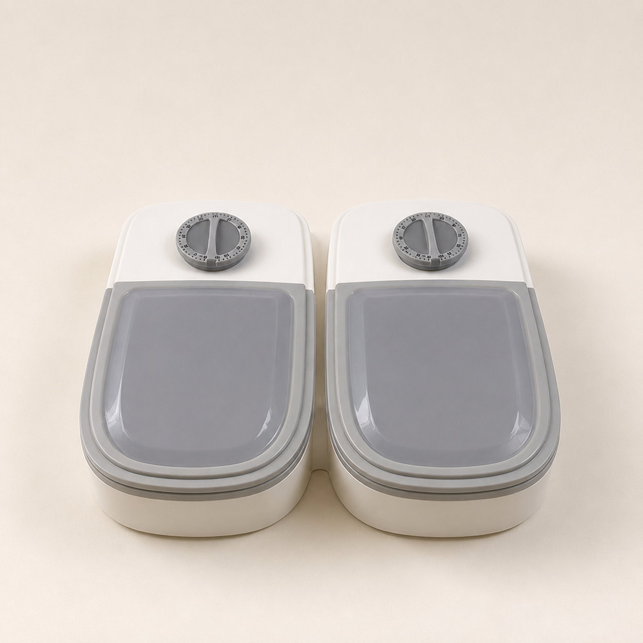 Two closed mechanical timed pet feeder compartments