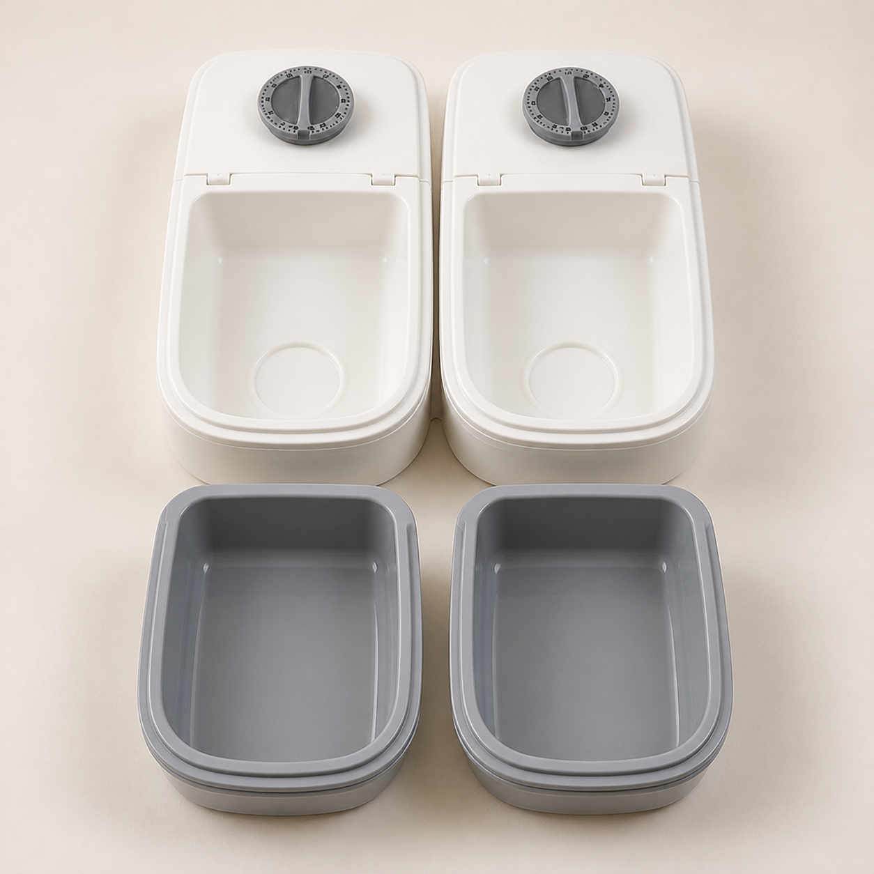 Grey food trays removed from the feeder bodies