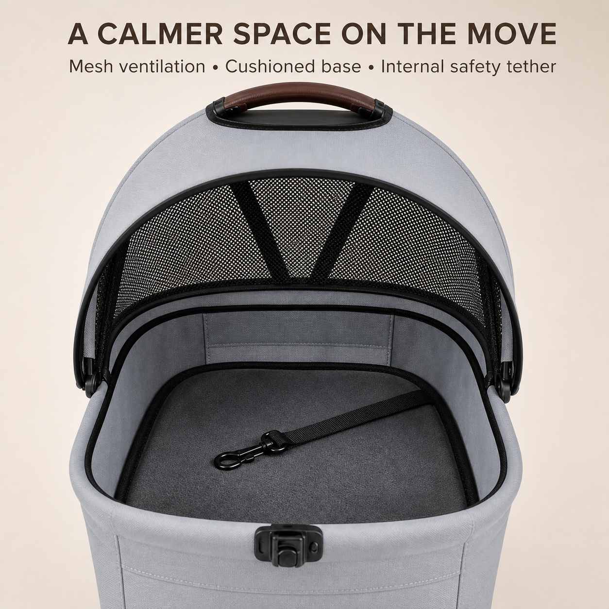 Grey pet carrier interior with mesh cushion and safety tether