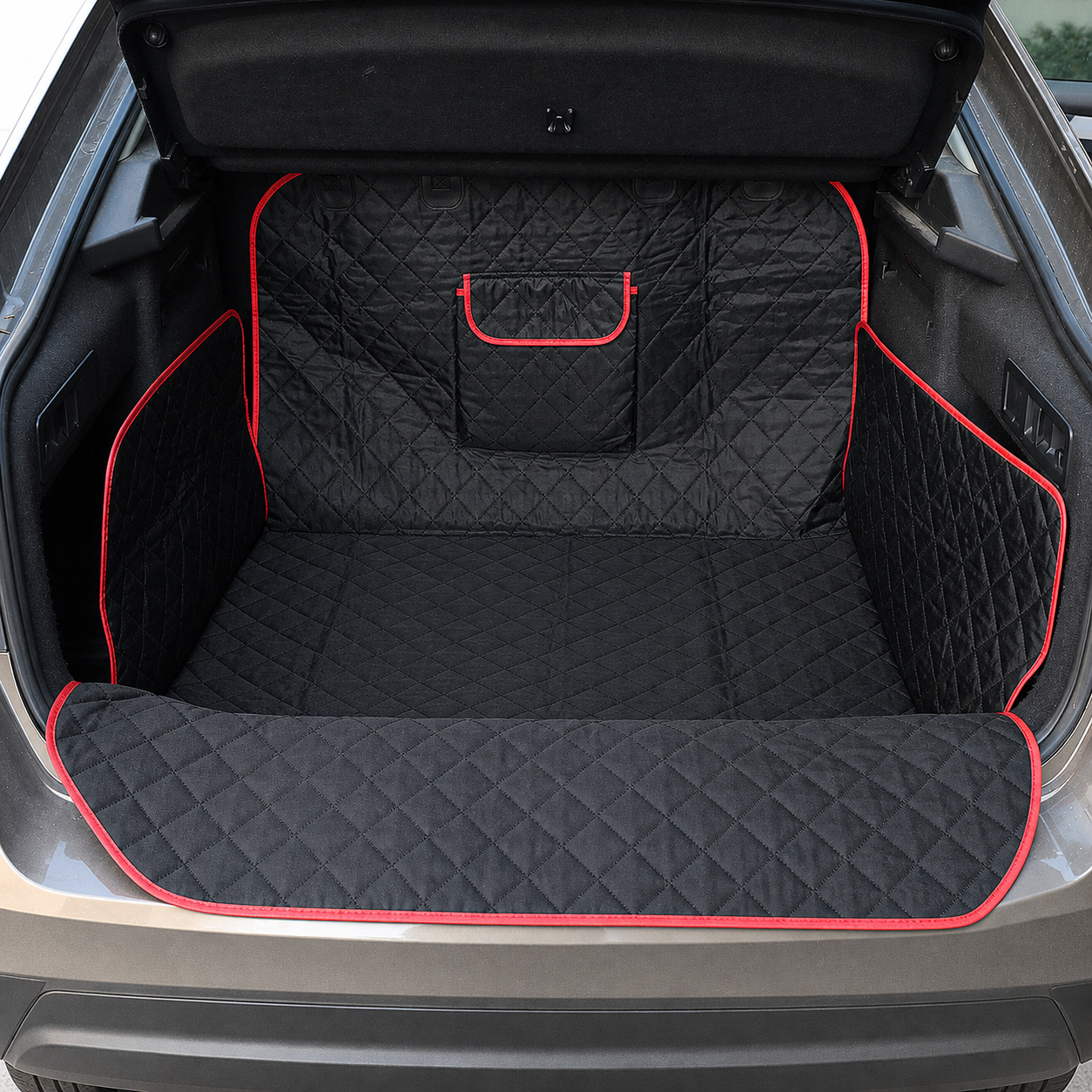 Black quilted dog boot liner installed in an open hatchback